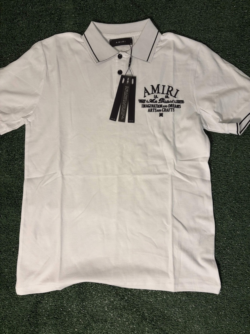 White Polo with Black Piping and Embroidered Chest Logo